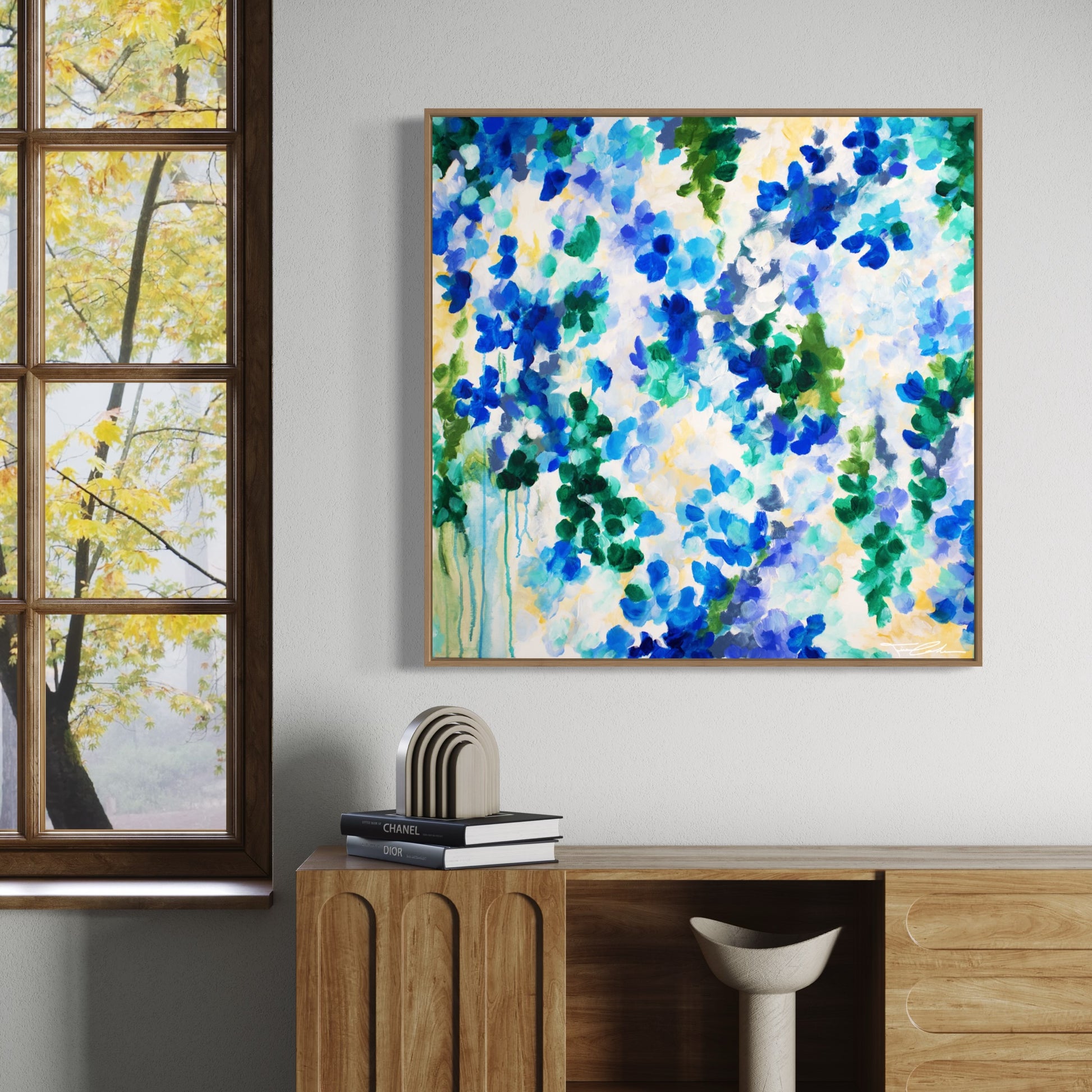mockup abstract painting on a wall flower motives blue wood frame